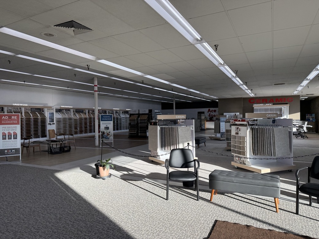 Interior of Flooring America-Spencer's spacious showroom featuring carpet, hardwood, luxury vinyl, and tile displays in Spencer, Iowa.