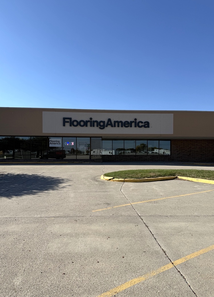 Exterior of Flooring America-Spencer in Spencer, Iowa, showing the storefront, Flooring America signage, and main entrance.
