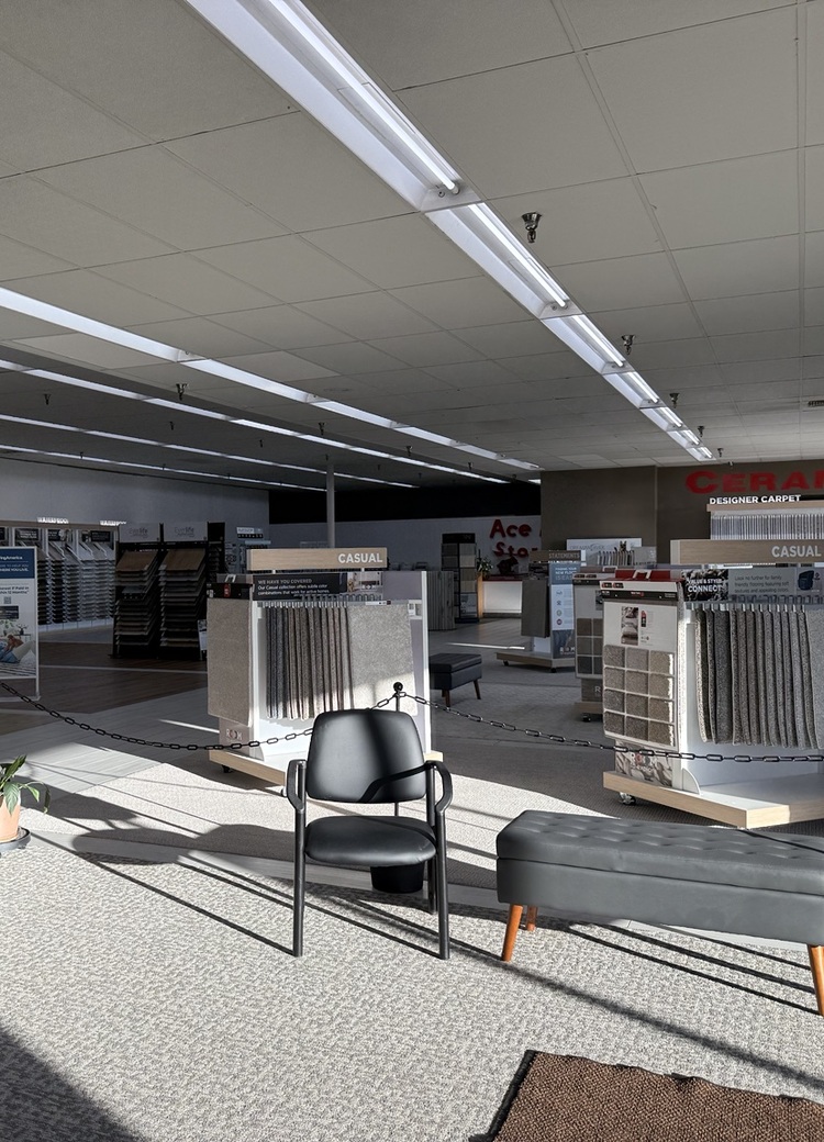 Interior of Flooring America-Spencer's spacious showroom featuring carpet, hardwood, luxury vinyl, and tile displays in Spencer, Iowa.
